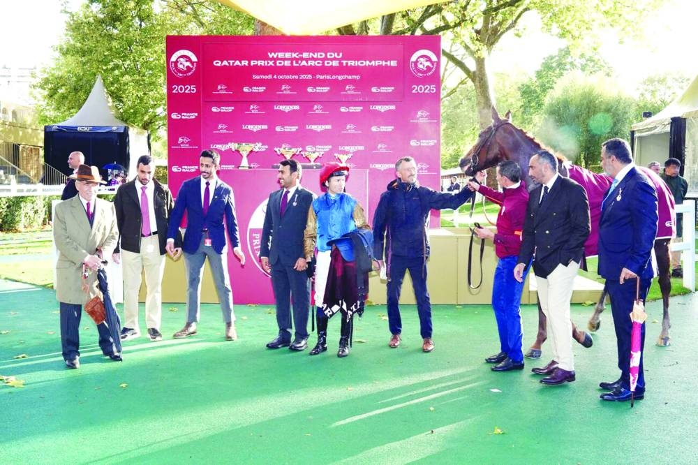 Connections of Wathnan Racing’s First Look celebrate after the four-year-old gelding won the Gr 2 Qatar Prix Dollar Saturday.