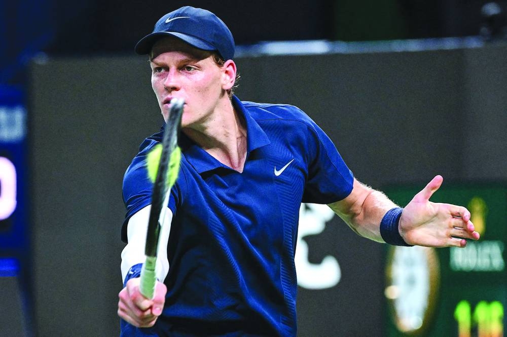 Italy’s Jannik Sinner hits a return to Germany’s Daniel Altmaier during their singles match at the Shanghai Masters Saturday. AFP