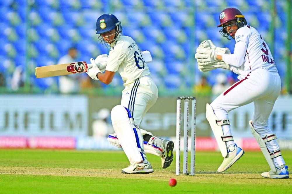 India’s opener Yashasvi Jaiswal (left) watches the ball after playing a shot during the first day of the second and last Test against West Indies in New Delhi Friday. AFP