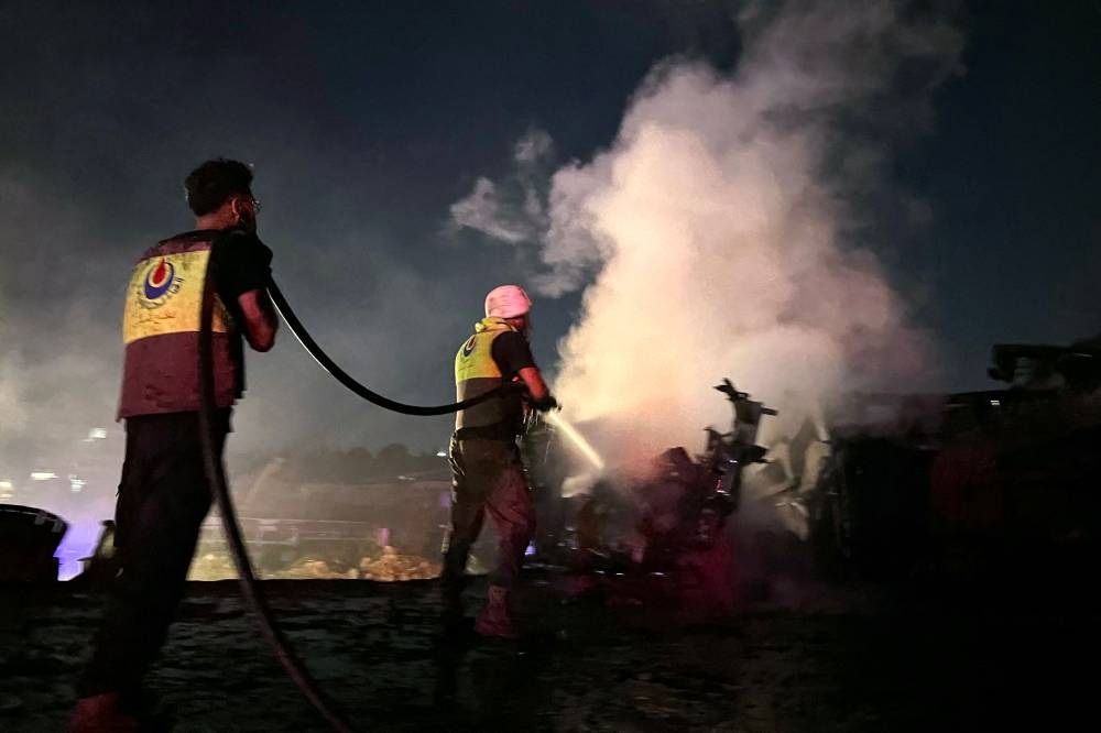 Firefighters douse the flames at the site of an overnight Israeli strike in Al-Msayleh area in southern Lebanon on October 11, 2025. Lebanese President Joseph Aoun condemned Israel on October 11 for carrying out overnight strikes on civilian facilities that the health ministry said killed at least one person. (AFP)