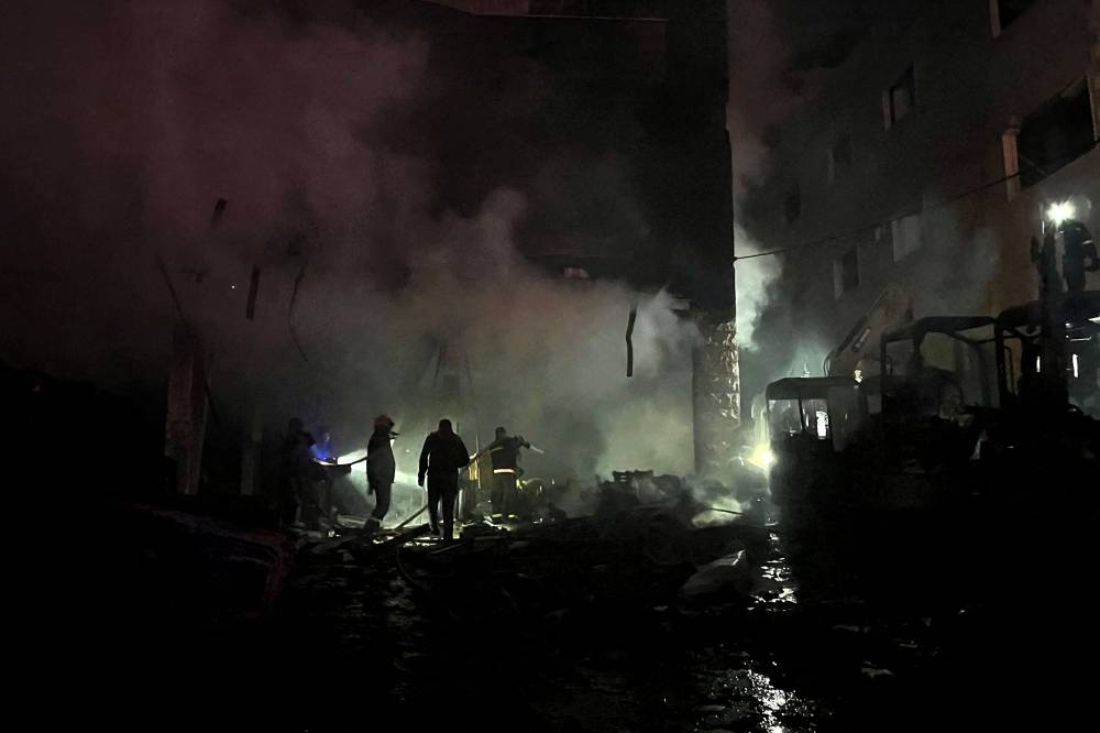 Firefighters douse the flames at the site of an overnight Israeli strike in Al-Msayleh area in southern Lebanon on October 11, 2025. Lebanese President Joseph Aoun condemned Israel on October 11 for carrying out overnight strikes on civilian facilities that the health ministry said killed at least one person. (AFP)