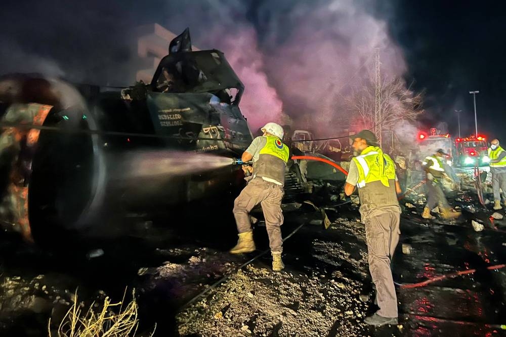 Firefighters douse the flames at the site of an overnight Israeli strike in Al-Msayleh area in southern Lebanon on October 11, 2025. Lebanese President Joseph Aoun condemned Israel on October 11 for carrying out overnight strikes on civilian facilities that the health ministry said killed at least one person. (AFP)