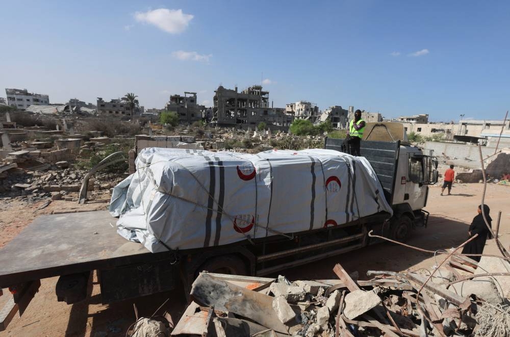 A truck carries aid for Palestinians, amid a ceasefire between Israel and Hamas in Gaza, in Khan Younis, in the southern Gaza Strip, on Saturday. REUTERS