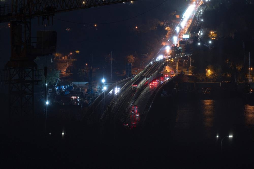 A general view of a road during a power outage in Kyiv on Friday, following a Russian missiles and drones attacks amid the Russian invasion of Ukraine. AFP