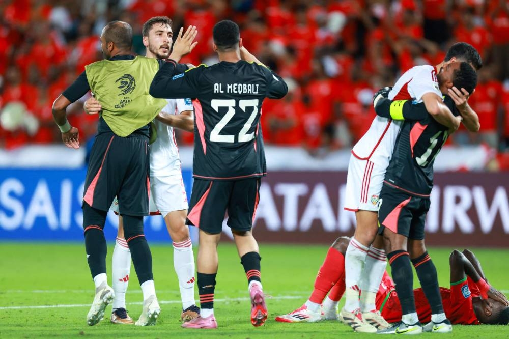 UAE players celebrate their win at the end of the FIFA World Cup 2026 Asian qualifier football match between United Arab Emirates and Oman at Jassim Bin Hamad Stadium in Doha on Saturday. AFP