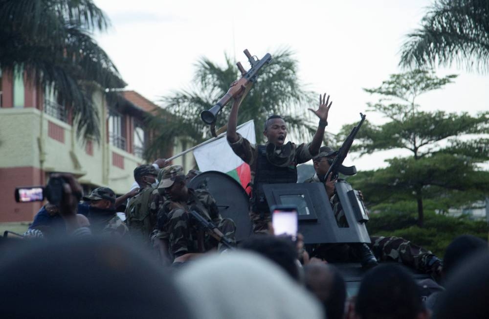 A Malagasy military officer gestures to protesters during a nationwide youth-led protest over frequent power outages and water shortages, in Antananarivo, Madagascar, on Saturday. REUTERS