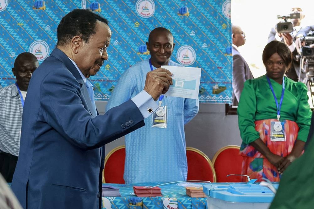 Paul Biya, President of Cameroon and presidential candidate for the Cameroon People's Democratic Movement (CPDM), casts his ballot at a polling station in Yaounde on Sunday during Cameroon's presidential election. AFP