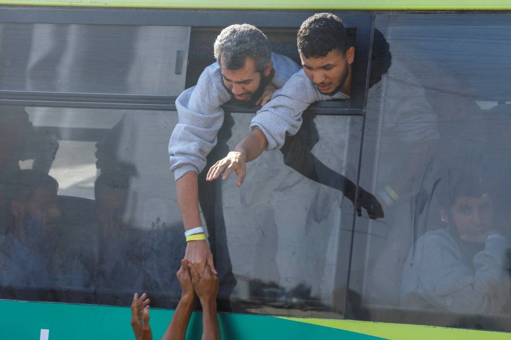 Freed Palestinian prisoners are greeted after they were released by Israel as part of a hostages-prisoners swap and a ceasefire deal between Hamas and Israel, in Khan Younis in the southern Gaza Strip, October 13, 2025. REUTERS