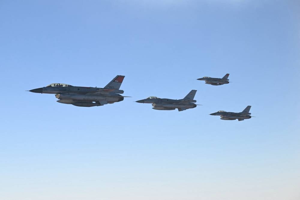 Egyptian flighter jets escort the Air Force One with US Donald Trump onboard before his arrival in Sharm el-Sheikh on Monday, to attend a summit on Gaza. AFP
