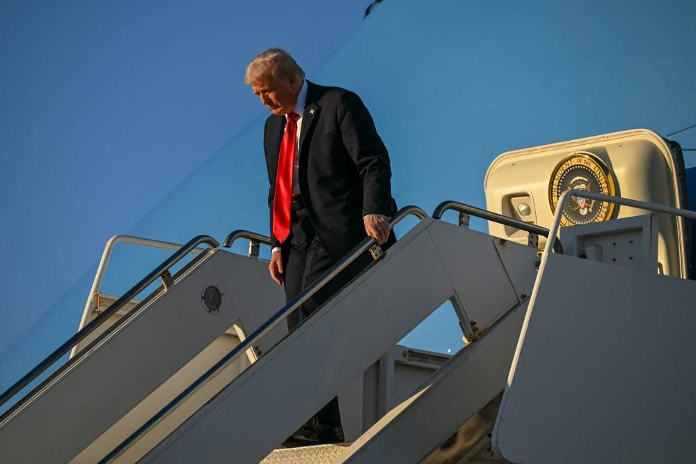 US President Donald Trump disembarks from the Air Force One upon his arrival at Sharm el-Sheikh International Airport in Sharm el-Sheikh on Monday, to attend a summit on Gaza. AFP