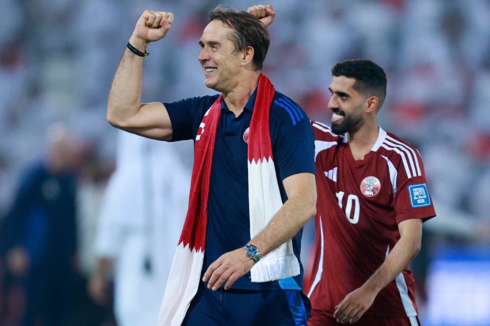 Qatar's Spanish coach Julian Lopetegui and Qatar's forward #10 Hassan Al-Haydos celebrate after the FIFA World Cup 2026 Asian qualifier football match between Qatar and the UAE at Jassim Bin Hamad Stadium in Doha on Tuesday. AFP