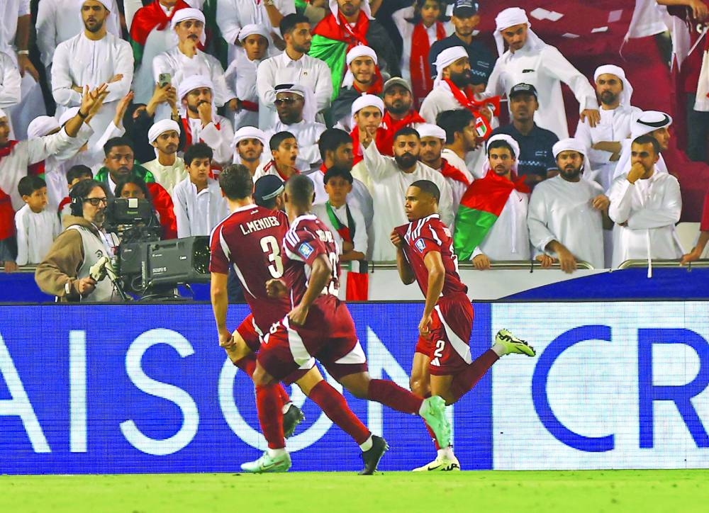 Qatar's Pedro Miguel celebrates scoring their second goal with teammates. REUTERS