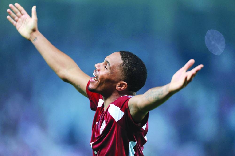 Qatar's defender #2 Pedro Miguel celebrates after the match. AFP