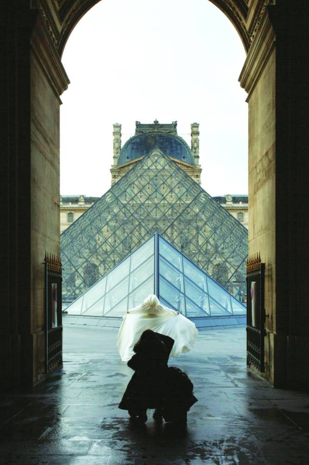 A bride’s photoshoot captured from Passage Richelieu, Grand Louvre (1983–1989), Paris 2021 Commissioned by M+, 2021. PICTURE: Giovanna Silva