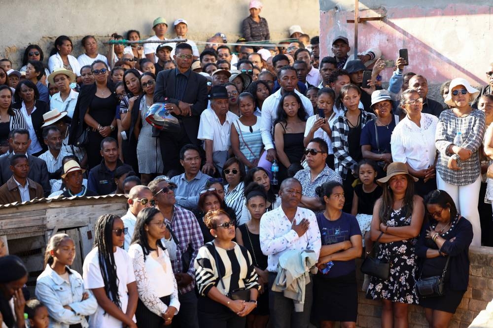 Mourners attend the funeral of Safidy Rakotoarisoa, who, according to his family, died during demonstrations, in Antananarivo, Madagascar on Wednesday. REUTERS