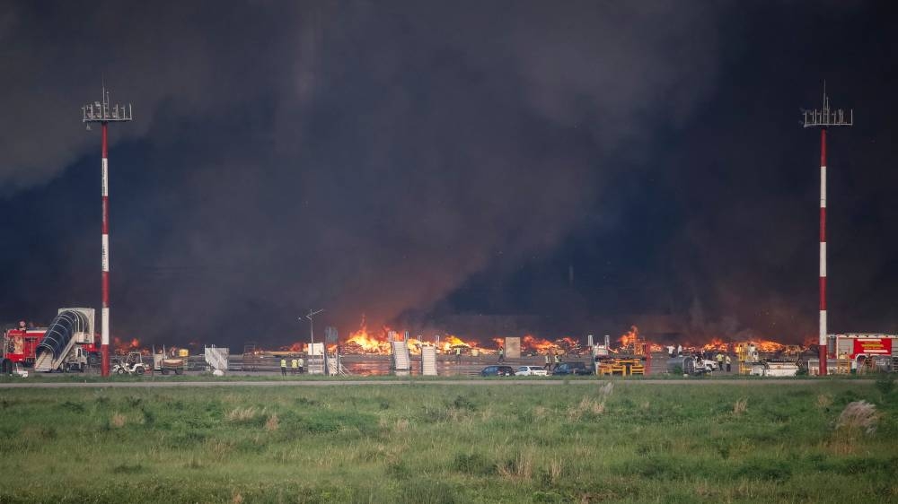Firefighters try to extinguish a fire that broke out in the cargo section of Hazrat Shahjalal International Airport in Dhaka on Saturday.  AFP