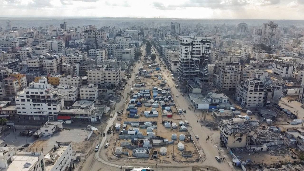 A drone view shows tents of displaced Palestinians and a destroyed city, following the withdrawal of the Israeli forces from the area, amid a ceasefire between Israel and Hamas in Gaza, in Gaza City, Saturday. REUTERS