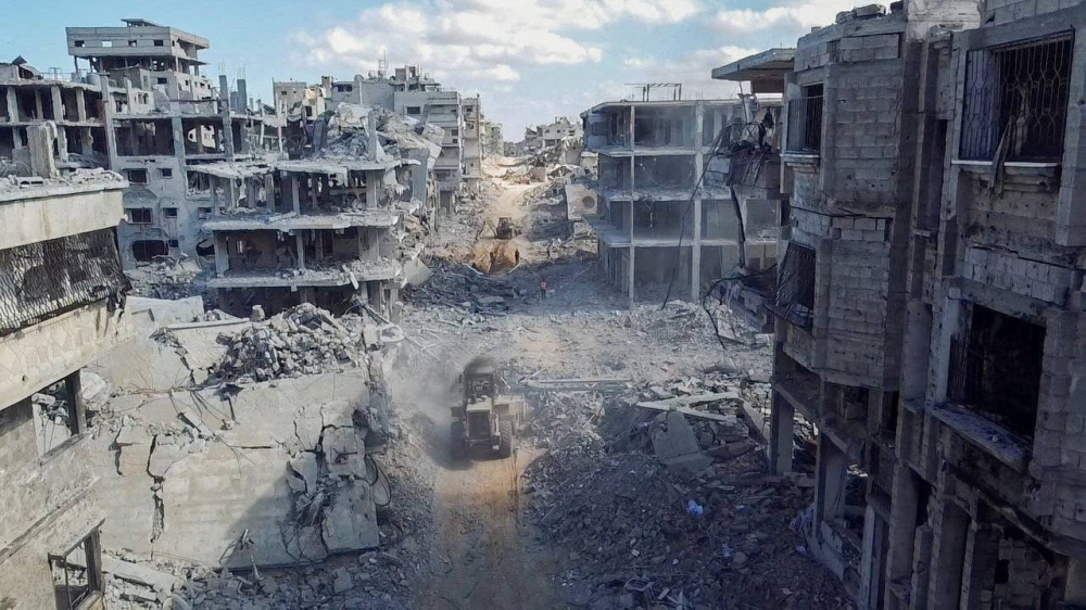 A drone view shows heavy machinery operating around a destroyed residential neighbourhood, following the withdrawal of the Israeli forces from the area, amid a ceasefire between Israel and Hamas in Gaza, in Gaza City, Saturday. REUTERS
