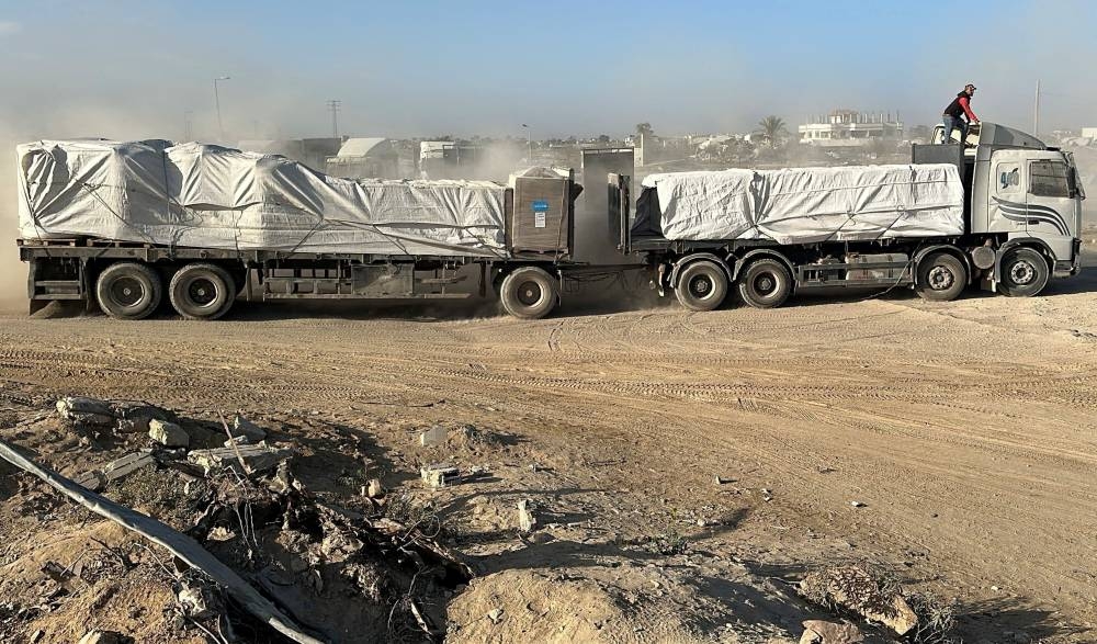 A truck carries aid for Palestinians, amid a ceasefire between Israel and Hamas in Gaza, in Deir Al-Balah, in the central Gaza Strip, on Tuesday. REUTERS