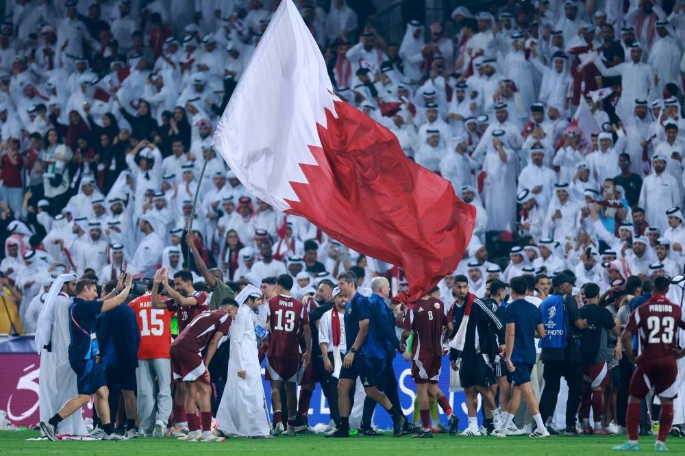 Qatar's players celebrate after the FIFA World Cup 2026 Asian qualifier football match between Qatar and the UAE at Jassim Bin Hamad Stadium in Doha on Tuesday. AFP