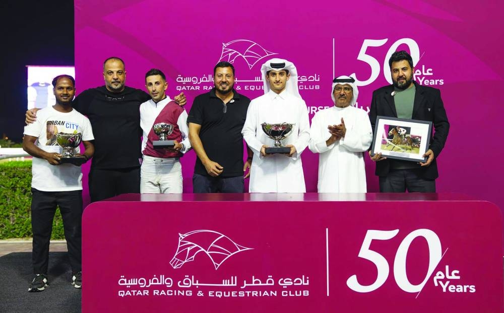 Connections of Grace Secret celebrate after the bay filly won the Asherij Cup at the QREC’s Al Rayyan Racecourse Wednesday. PICTURES: Juhaim