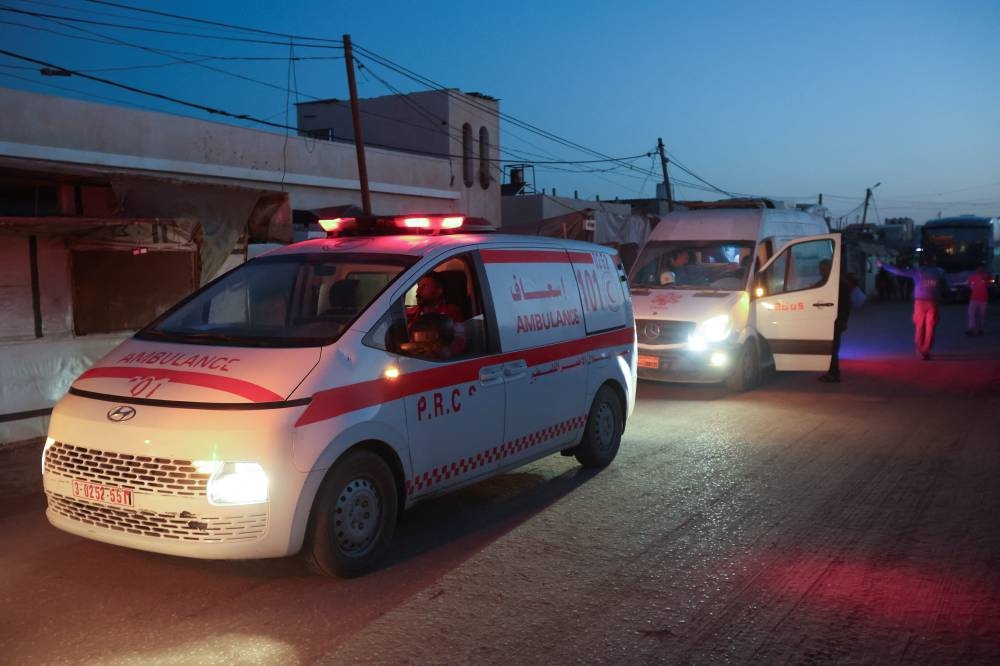 Ambulances carry Palestinian patients before they are transferred for medical treatment abroad, amid a ceasefire between Israel and Hamas in Gaza, in Khan Younis, in the southern Gaza Strip, on Wednesday. REUTERS