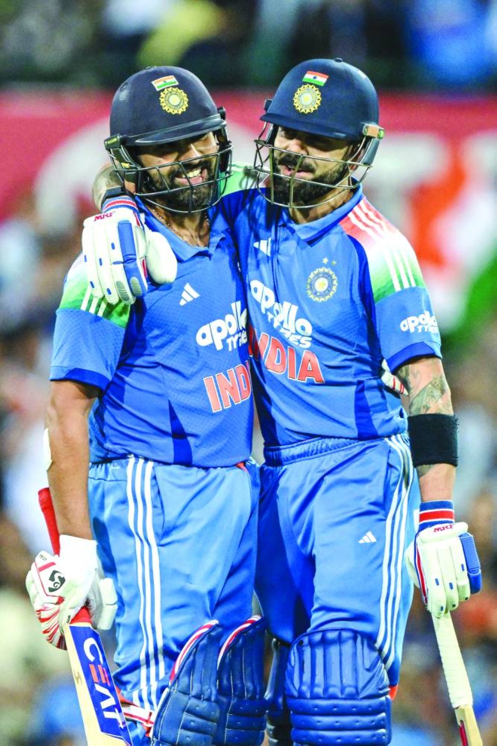India’s Rohit Sharma (left) celebrates with his teammate Virat Kohli after scoring a century during the third ODI against Australia at the Sydney Cricket Ground in Sydney Saturday. AFP