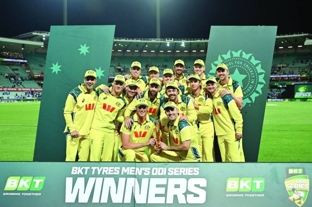 Australian team celebrates with the trophy after winning the one day international series against India at the Sydney Cricket Ground in Sydney Saturday. AFP