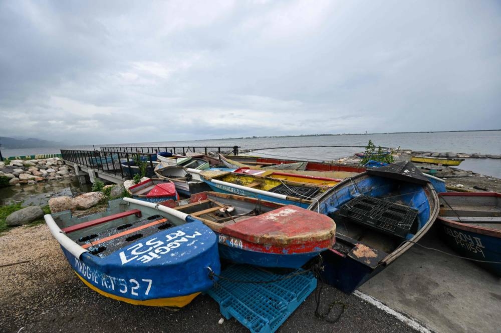 Fishermen boats are tied together in preparation for the arrival of Hurricane Melissa near the fishing village of Rae Town, East Kingston, Jamaica, on Sunday.  AFP