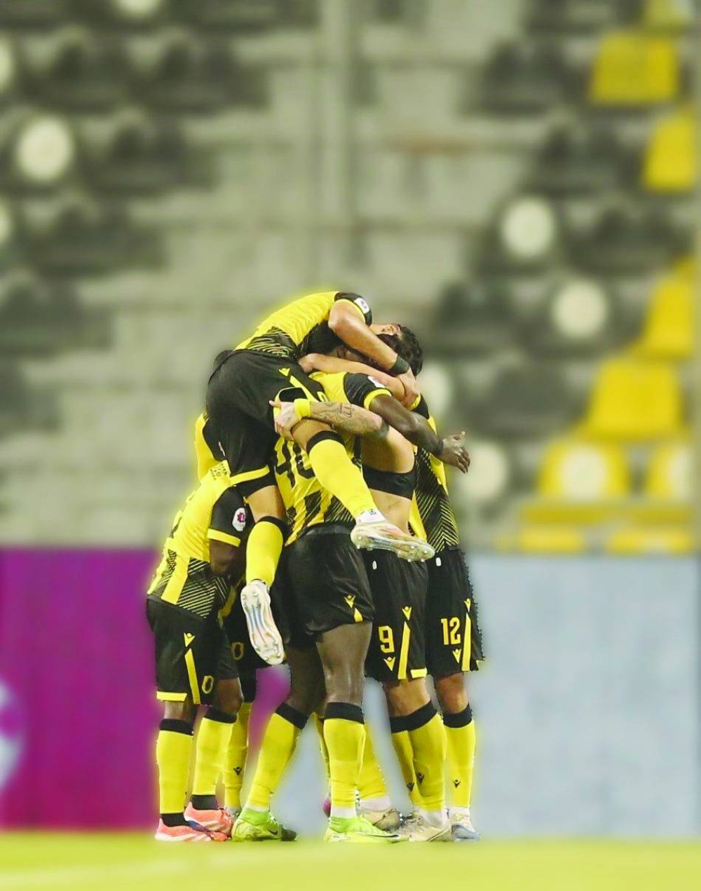 Qatar SC players celebrate their win over Umm Salal in the Qatar Stars League match Sunday.