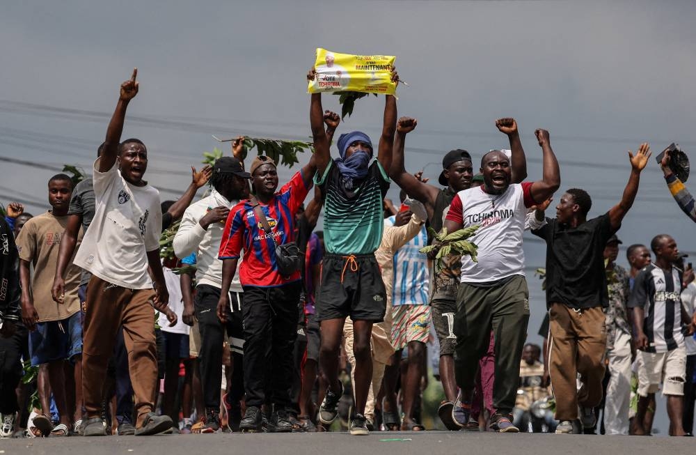 Supporters of the Cameroonian opposition presidential candidate Issa Tchiroma protest after the Constitutional Council declared Paul Biya the winner of the October 12 presidential election, in Douala, Cameroon, on Monday. REUTERS