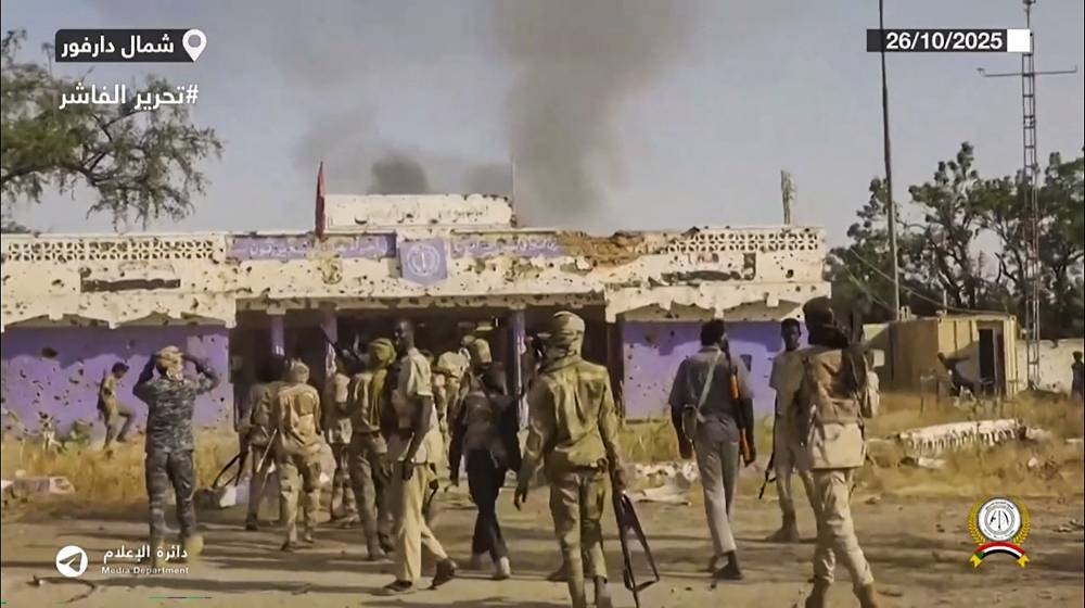 This image grab taken from handout video footage released on Sudan's paramilitary Rapid Support Forces (RSF) Telegram account on Sunday, shows RSF fighters holding weapons and celebrating in the streets of El-Fasher in Sudan's Darfur. AFP/SUDAN RAPID SUPPORT FORCES (RSF)