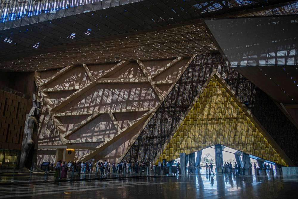 (FILES) Visitors tour the Grand Egyptian Museum in Giza on the southwestern outskirts of the capital Cairo on May 5, 2025.  (AFP)