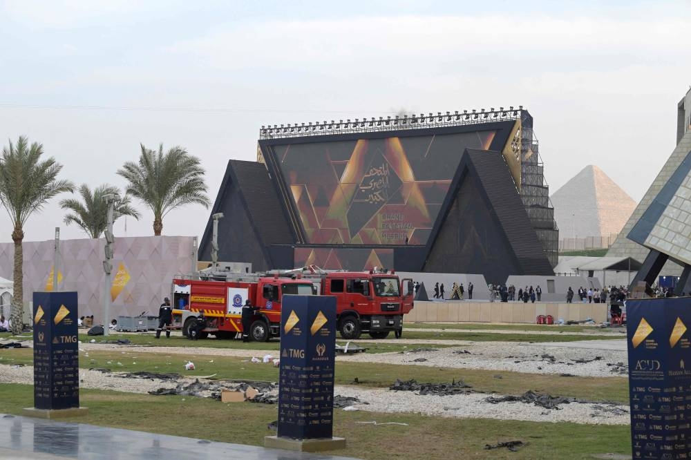 Fire engines are in position in the grounds of the Grand Egyptian Museum (GEM), with the Great Pyramid (R), prior to it's opening in Giza, on the southwestern outskirts of the capital Cairo on Saturday. AFP