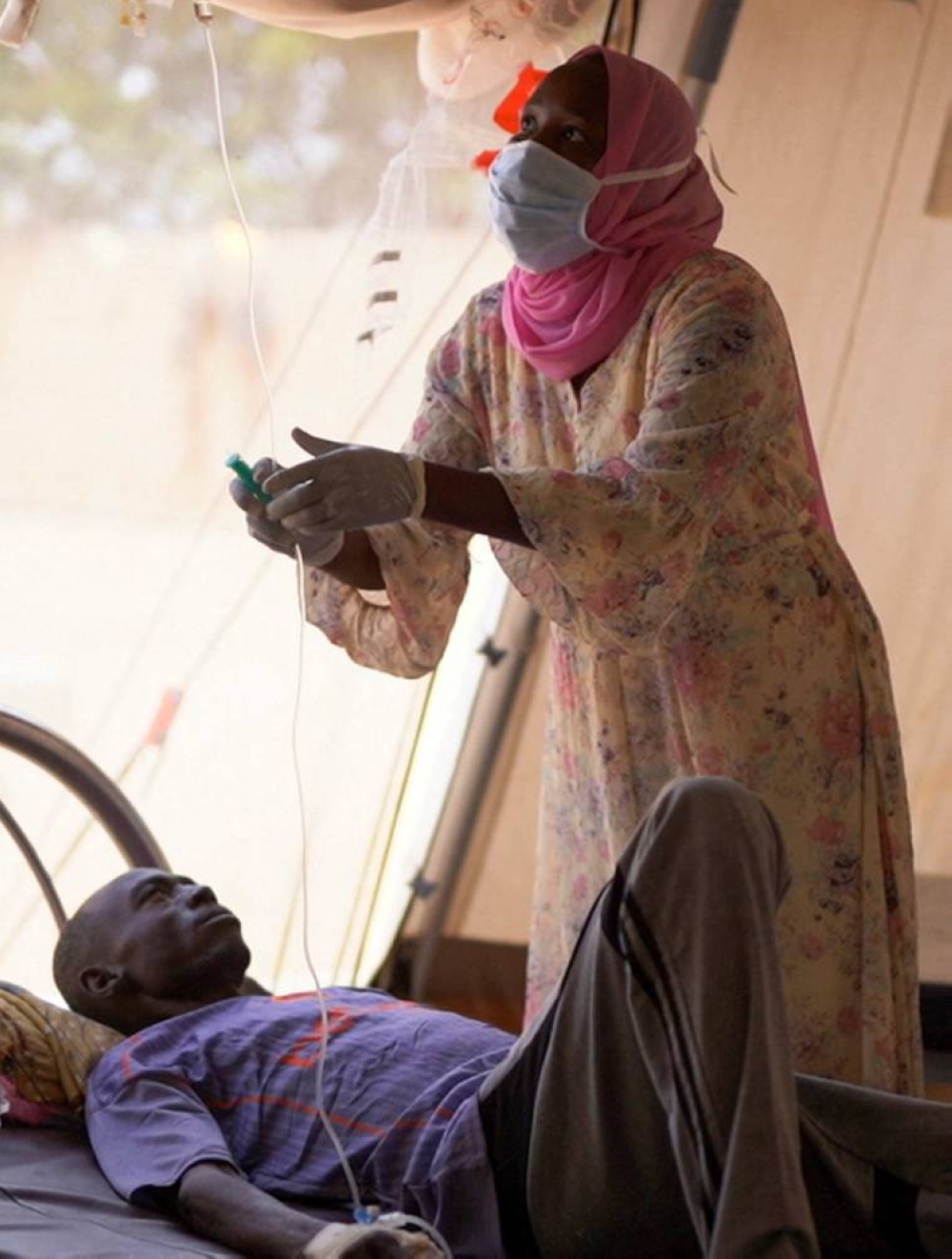 An injured displaced Sudanese man who fled violence in El-Fasher receives treatment at a makeshift clinic run by Medecins Sans Frontieres (MSF), in Tawila, North Darfur, Sudan, on Monday. REUTERS