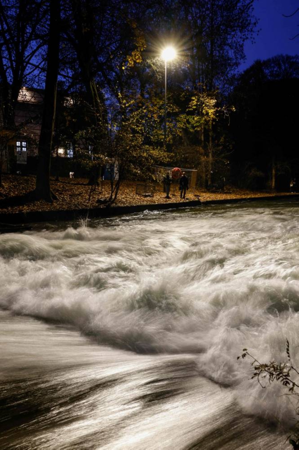 The famous Eisbach wave (Eisbachwelle) pictured at night appears flattened in the English Garden (Englischer Garten) in Munich, southern Germany, on Tuesday. AFP