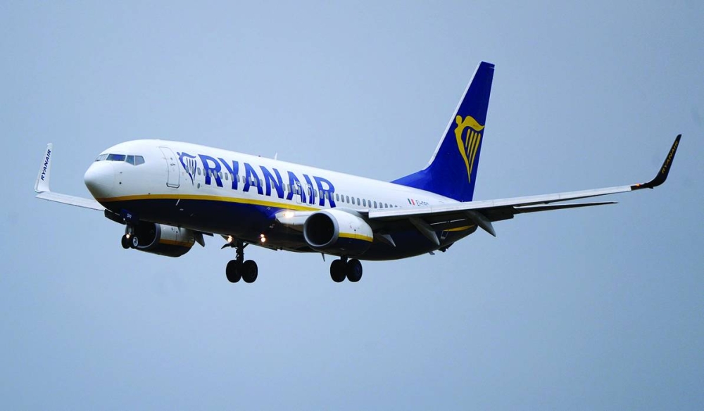 A Boeing 737 passenger aircraft operated by Ryanair comes into land at Dublin Airport. Ryanair expects to exceed its passenger growth target for the full year as the airline receives aircraft early from Boeing and demand for travel remains strong.