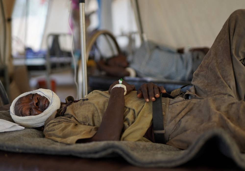 An injured displaced Sudanese man who fled violence in al-Fashir, receives treatment at a makeshift clinic run by Medecins Sans Frontieres (MSF), amid ongoing clashes between the paramilitary Rapid Support Forces (RSF) and the Sudanese army, in Tawila, North Darfur, Sudan on Monday. REUTERS