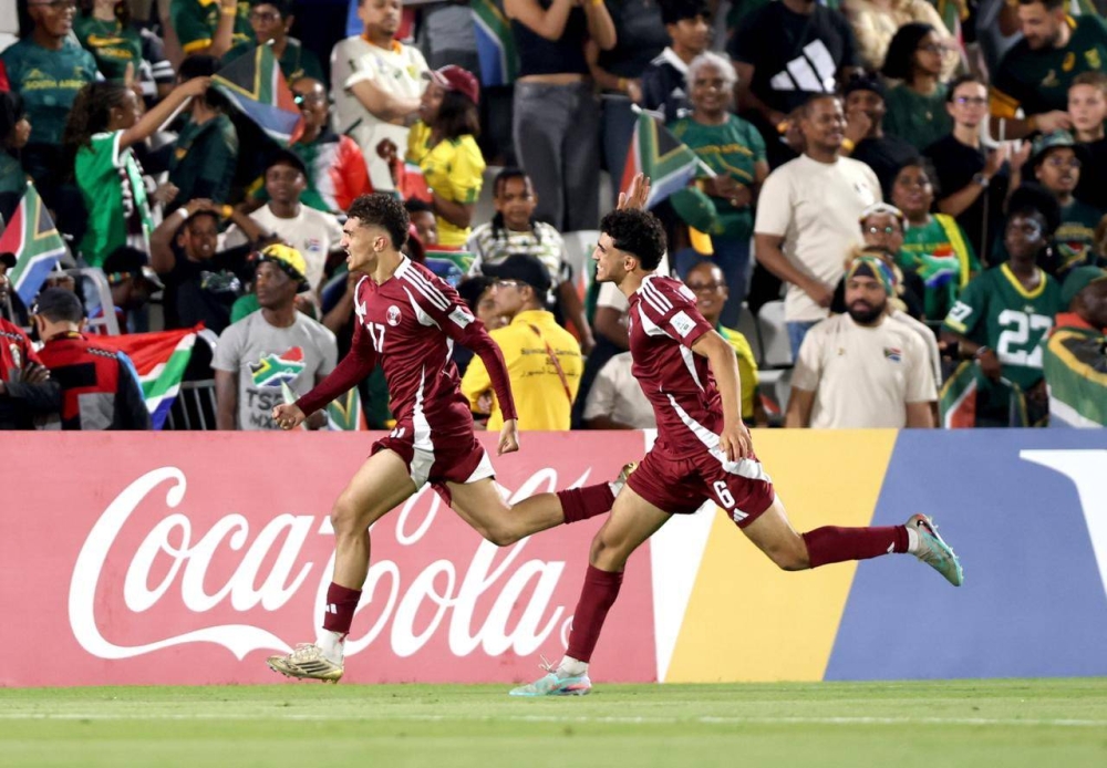Qatar’s Yazan Mohamed (left) celebrates after scoring against South Africa at the FIFA U-17 World Cup at Aspire Zone Thursday.