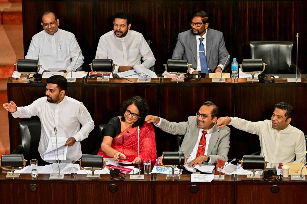Sri Lanka's President Anura Kumara Dissanayake (left) presents the 2026 budget to parliament as Prime Minister Harini Amarasuriya (second left), Minister of Transport, Highways and Urban Development Bimal Rathnayake (second right) and Minister of Health and Mass Media Nalinda Jayatissa (right) watch in Colombo yesterday.