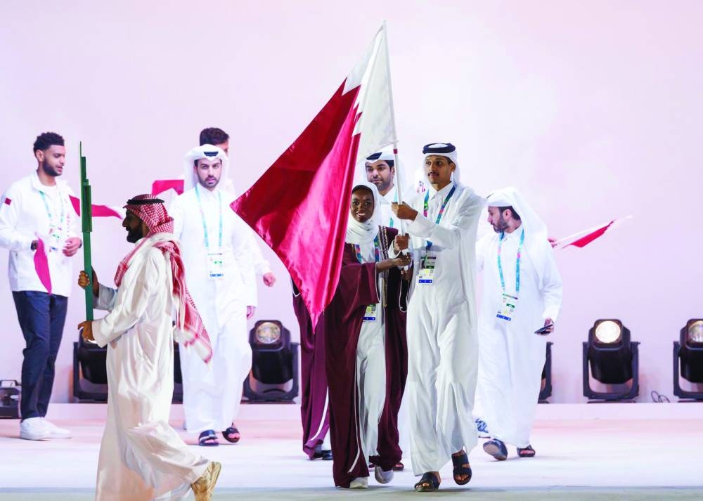 
The Qatari flag was carried in the parade by volleyball player Mubarak al-Kuwari and fencer Zakaria al-Abdullah. 