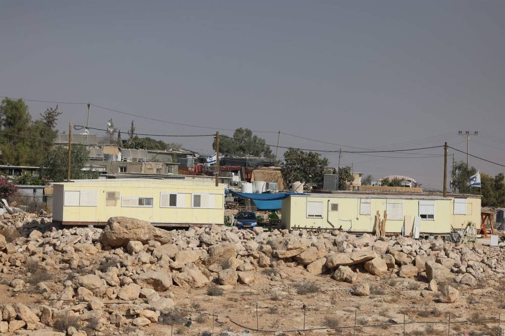 Israeli settler caravans, part of a new outpost, are seen close to the Palestinian Umm al-Kheir village, located near the settlement of Karmel, south of Yatta village some 15 kilometers south of the occupied West Bank city of Hebron, Sunday.