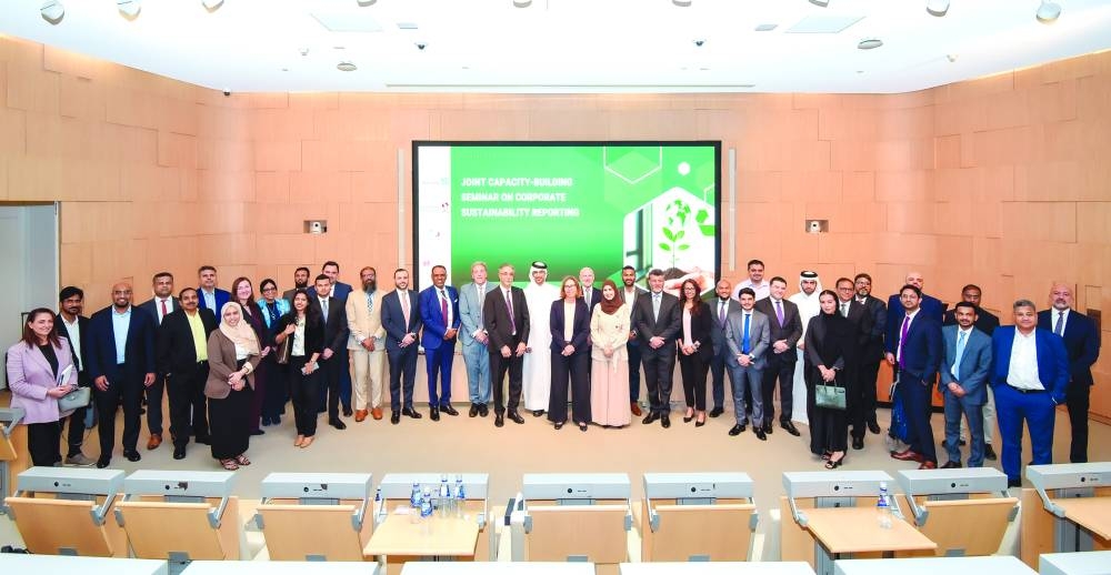 Participants in the seminar pose for a group photo.