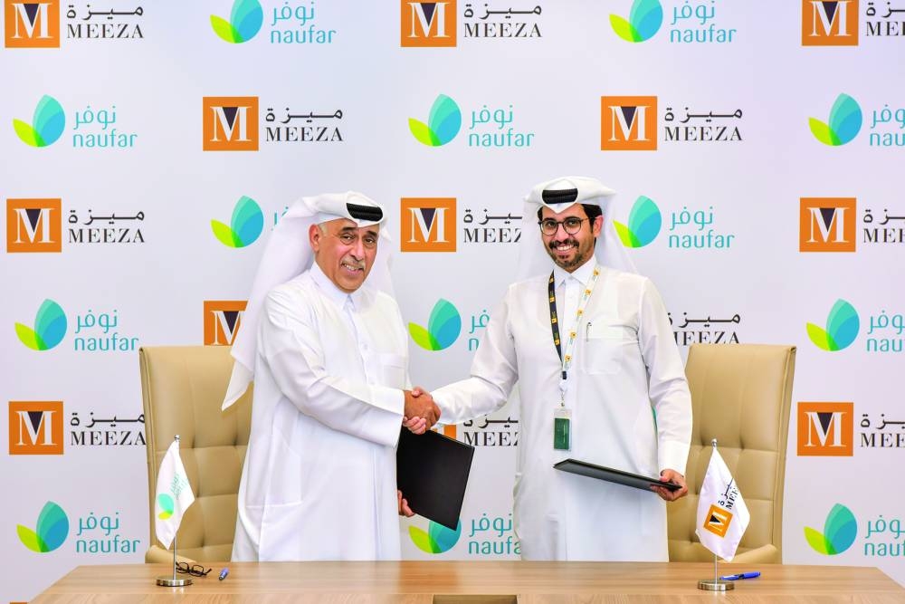 Mohammed Ali al-Ghaithani, CEO of MEEZA, and Saleh al-Muhanadi, Acting CEO & COO of Naufar, during the signing ceremony.