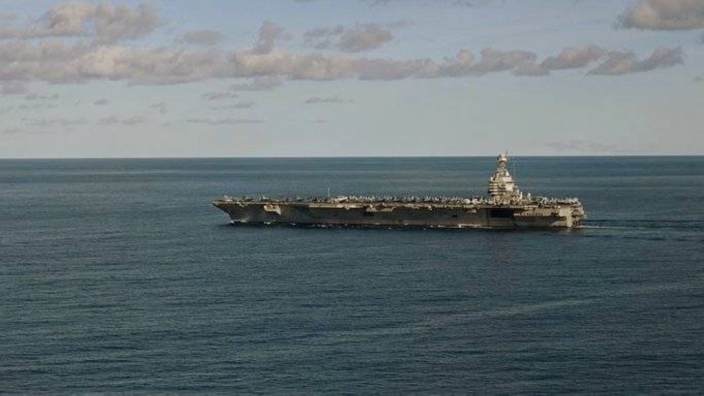 Massive military deployment in Venezuela coincides with arrival of US aircraft carrier off coast of Latin America