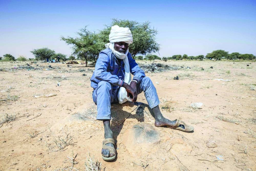 A Sudanese refugee sits in the registration area at Oure Cassoni camp in Chad.