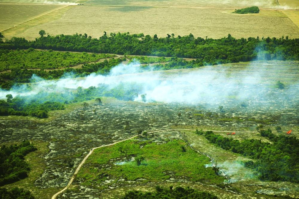 
An aerial view shows a fire burning in the Amazon rainforest to clear land for agriculture, during a Greenpeace flyover amid the UN Climate Change Conference (COP30), near Centro Novo in the state of Maranhao, Brazil. (Reuters) 