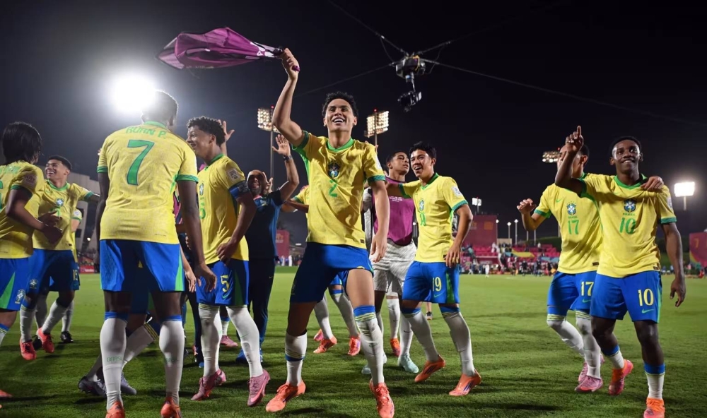 Brazil players celebrate after Dell's stoppage-time winner against Morocco in the U-17 World Cup quarter-final.