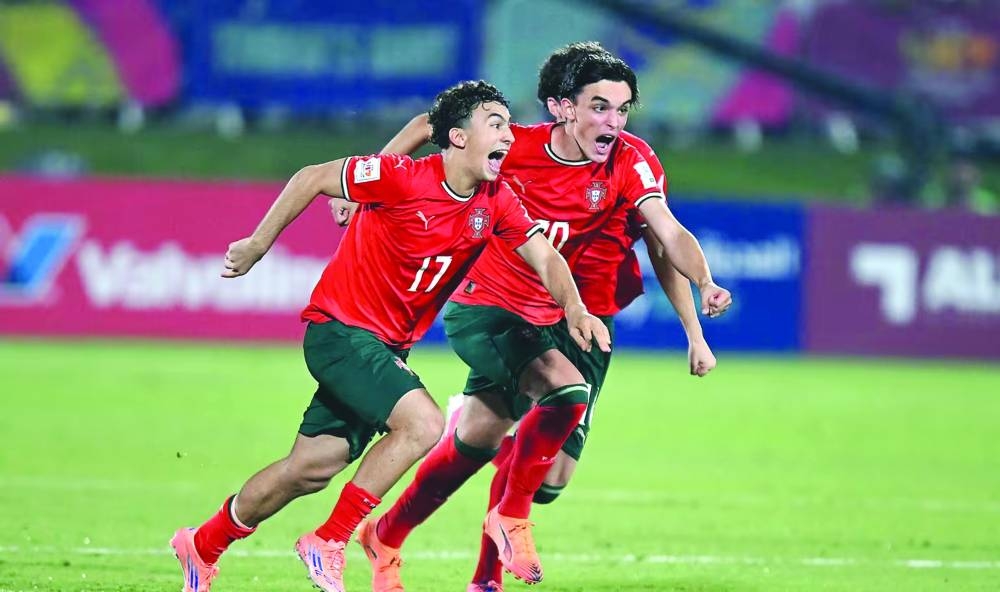 Portugal players celebrate after edging Brazil in a penalty shootout at the Aspire Zone yesterday.