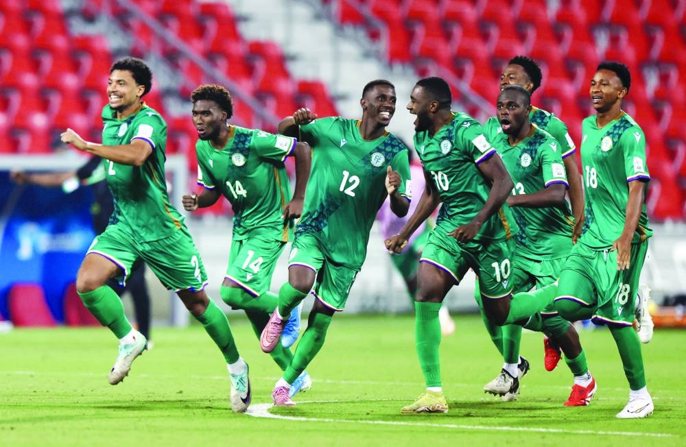 Comoros players celebrate after their penalty shootout win over Yemen at the Grand Hamad Stadium in Doha. (Reuters)
